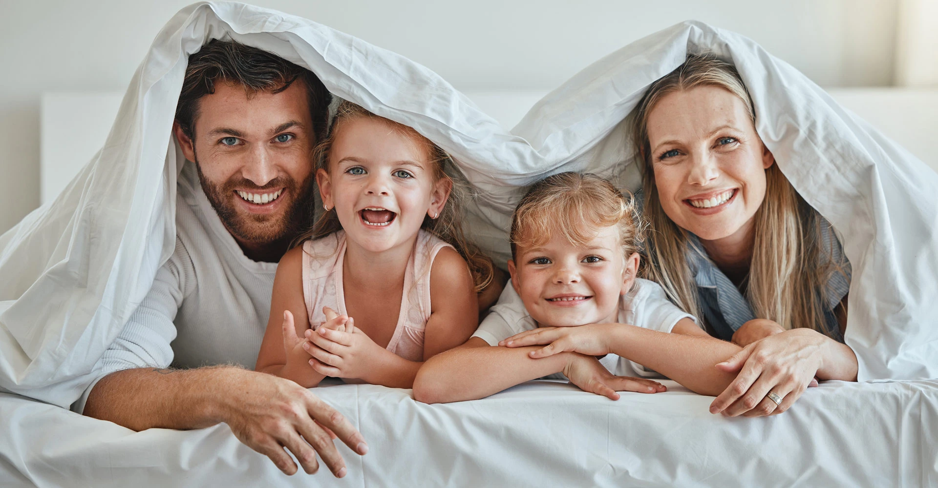 Family in Hotel Bed